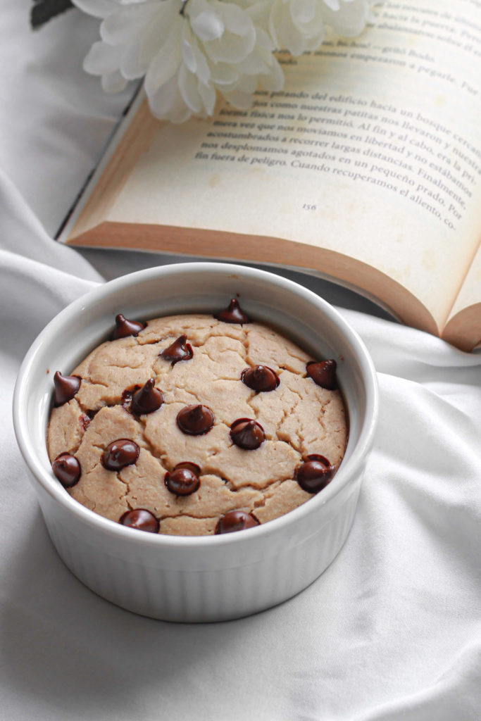 Chocolate chip baked oatmeal filled with chocolate enjoyed with a book