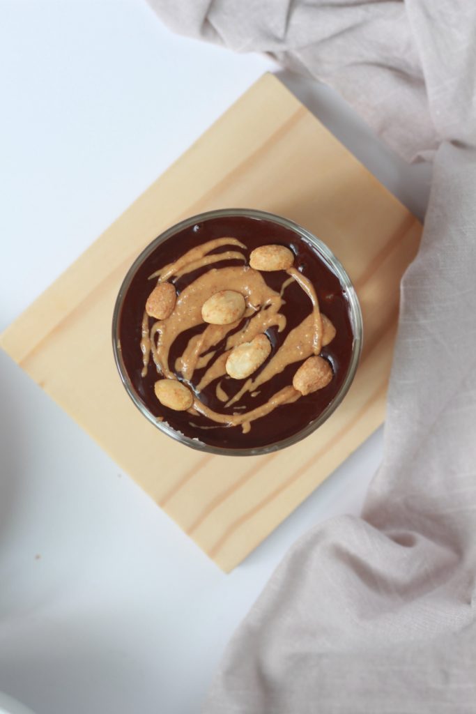showing peanuts on top of chocolate ganache