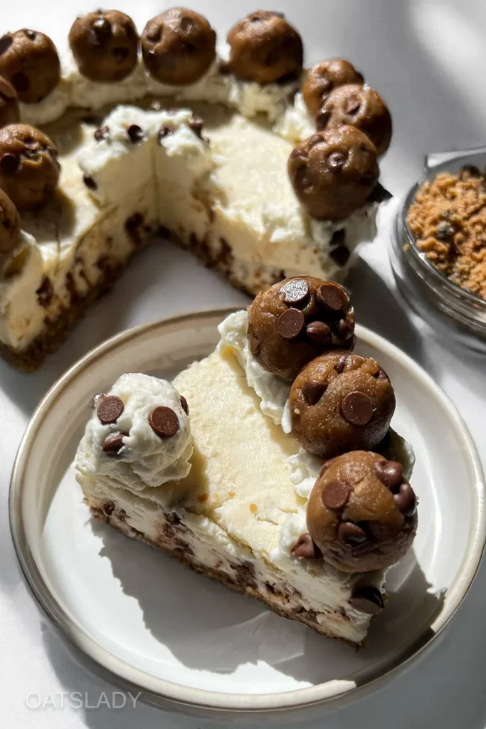 showing a chocolate chip cookie dough cheesecake no bake slice and the entire cheesecake
