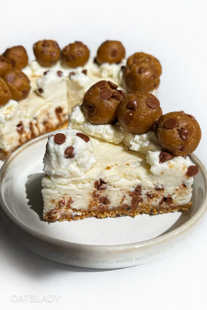 showing a no bake cheesecake with sugar cookie crust slice