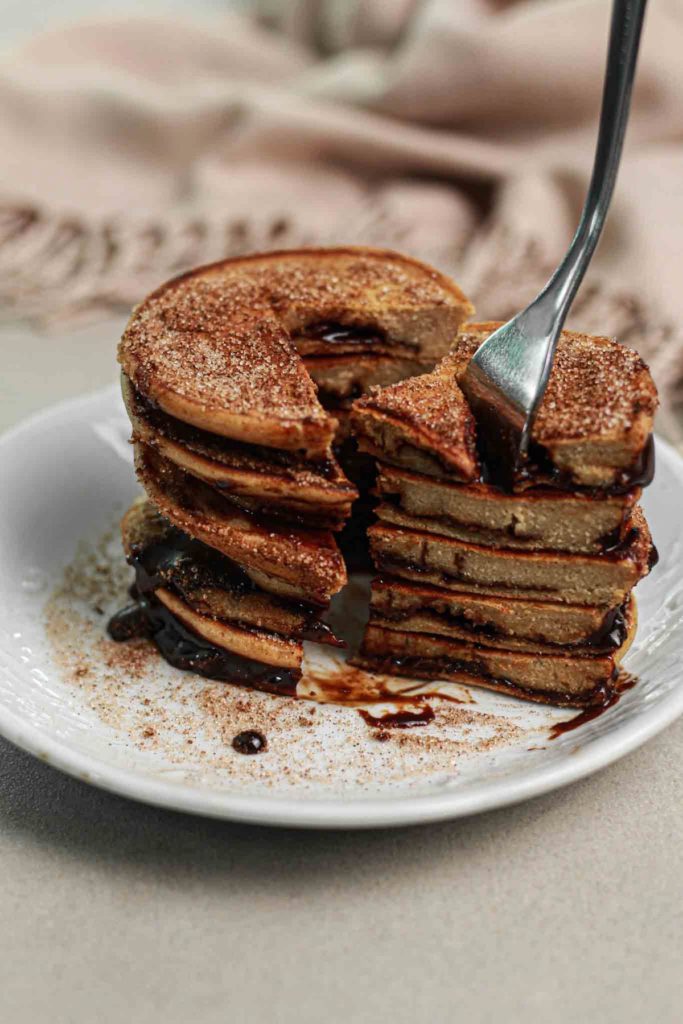 showing Best churro chocolate stuffed oat pancakes