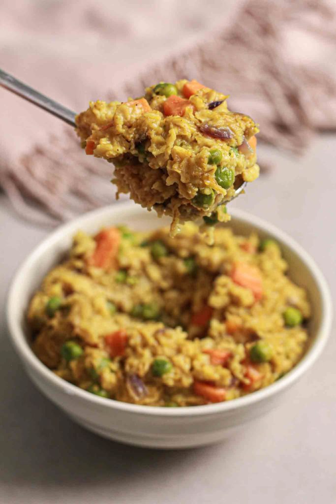 showing spoonful from best healthy masala oatmeal recipe